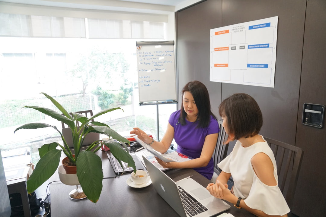 Left: Wong Mei Wai, Founder, CEO & Chief Change Catalyst working with her network of creators